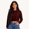 Aliza posing in plain Maroon Female Cropped Hoodie by Polimemes India