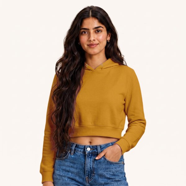 Aliza posing in plain Mustard Yellow Female Cropped Hoodie by Polimemes India